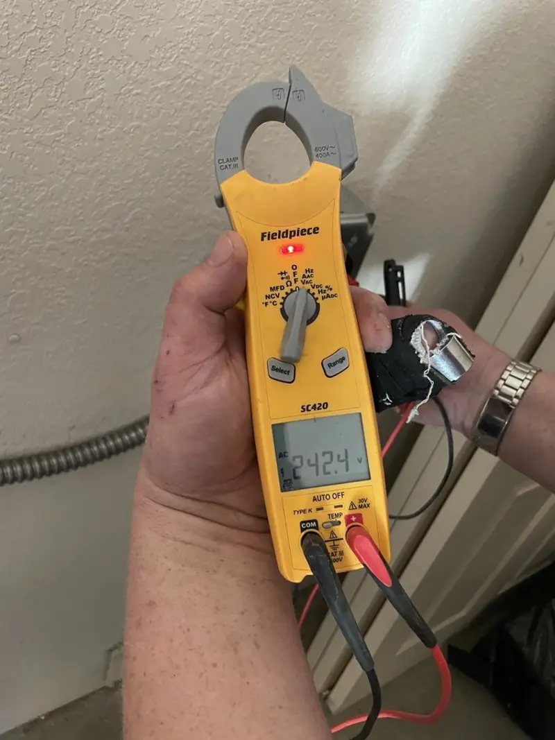 Voltage testing with clamp meter during Electrical Installation Services in East Haven